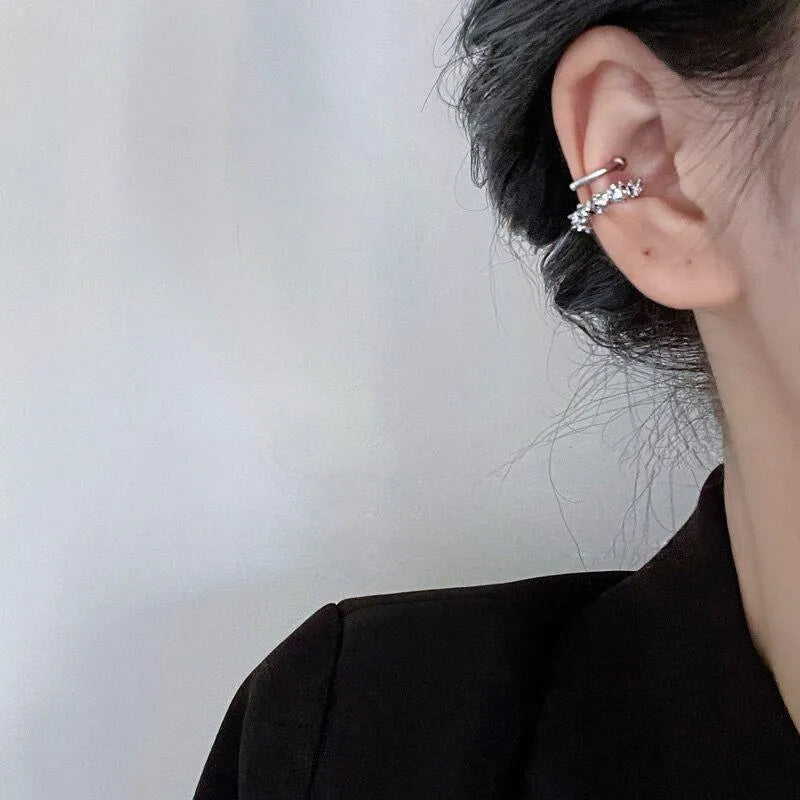 A pair of frosty B4710# coloured geometric ear clip earrings with an irregular shape.