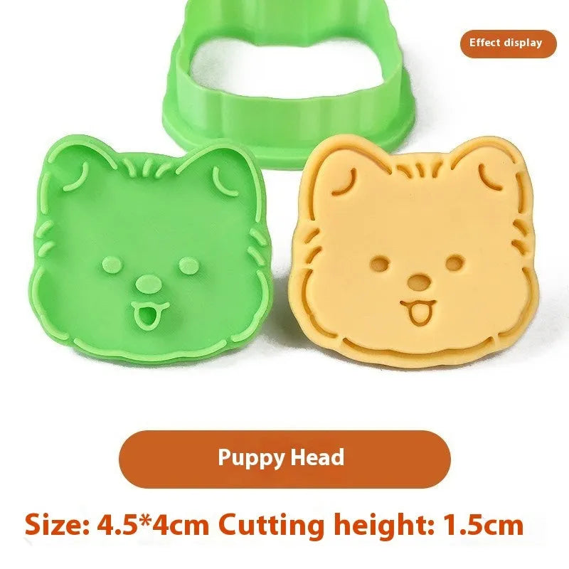 Plastic 3D biscuit mould with cartoon puppy designs including birthday hats and swimming rings