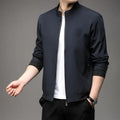 Man wearing a loose-fit black Korean-style autumn jacket with a lapel collar and zipper pockets.