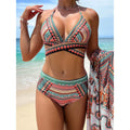 Blue women's three-piece bikini set with cross bandage front and high-waist bottoms on a mannequin.