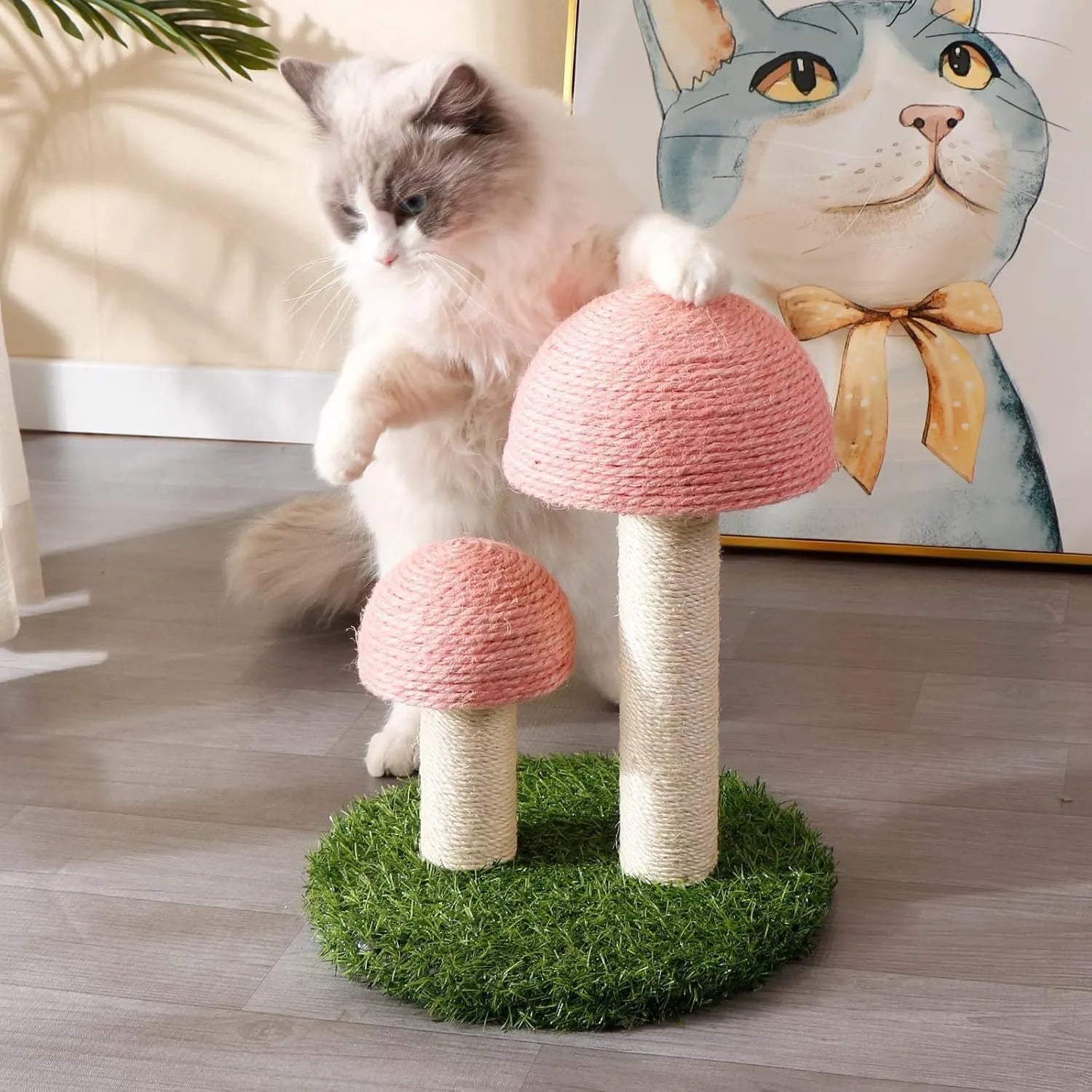 Pink mushroom-shaped cat scratching post with sisal fibre caps and pole for small cats.