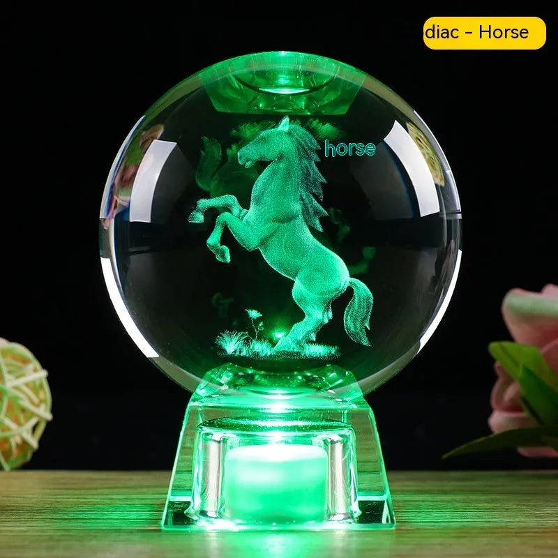 White crystal zodiac ornament with electronic luminous base showing Chinese animal design