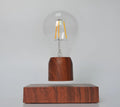 Magnetic levitation floating bulb lamp with glass bulb and imitation wood base