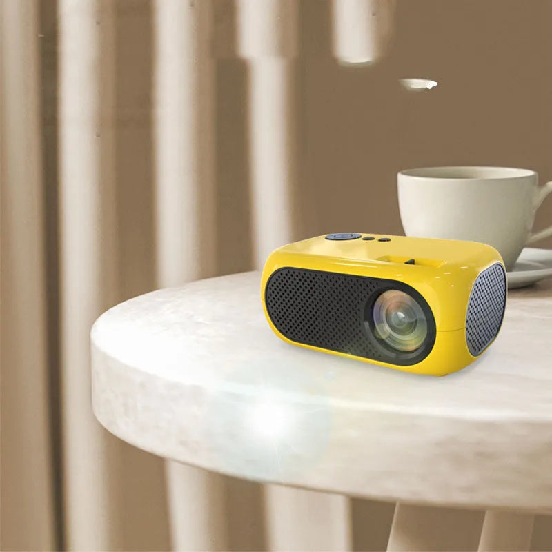 M24 portable mini projector in gold colour with compact 190mm design and AV cable