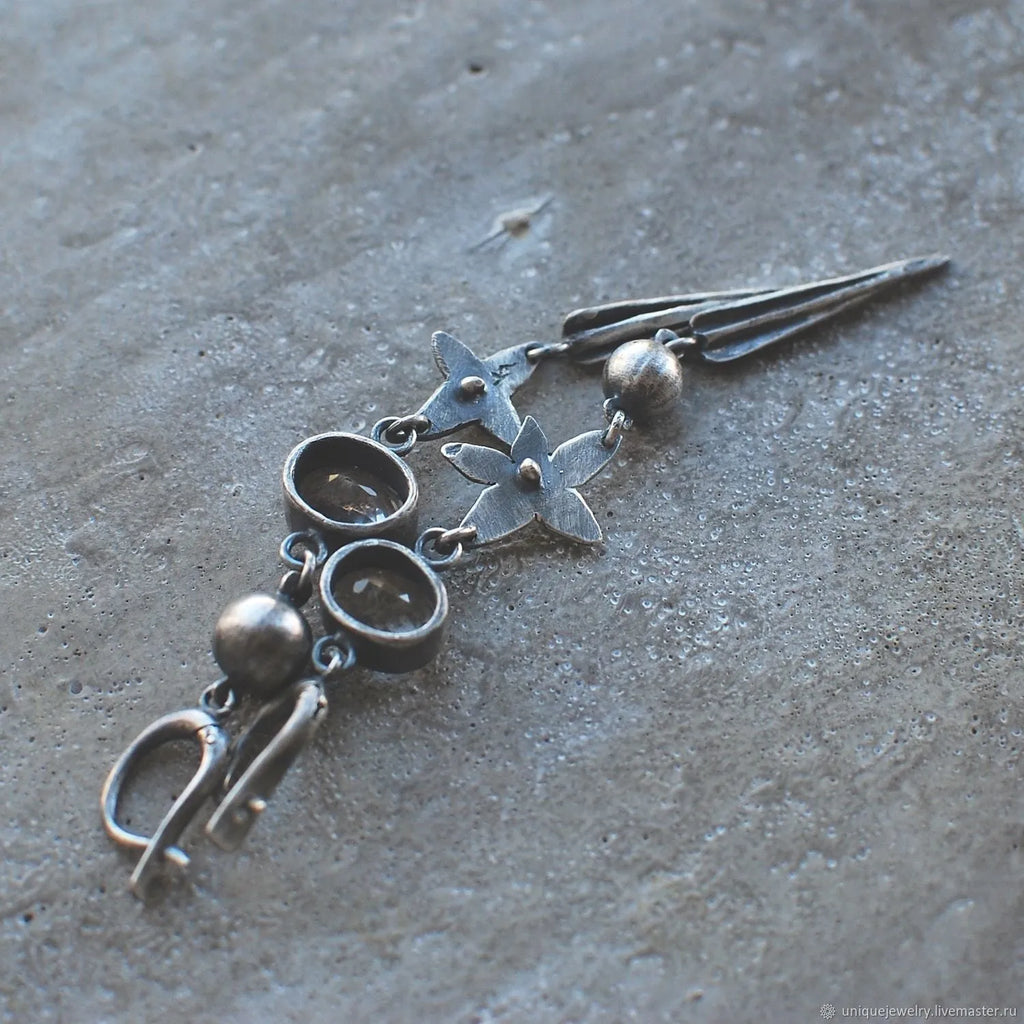Geometric pendant earrings with antique silver plating and rhinestone detailing
