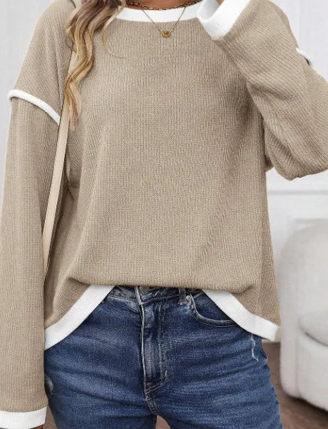 Drop shoulder loose knit top with four leaf clover pattern and contrast colour trim.