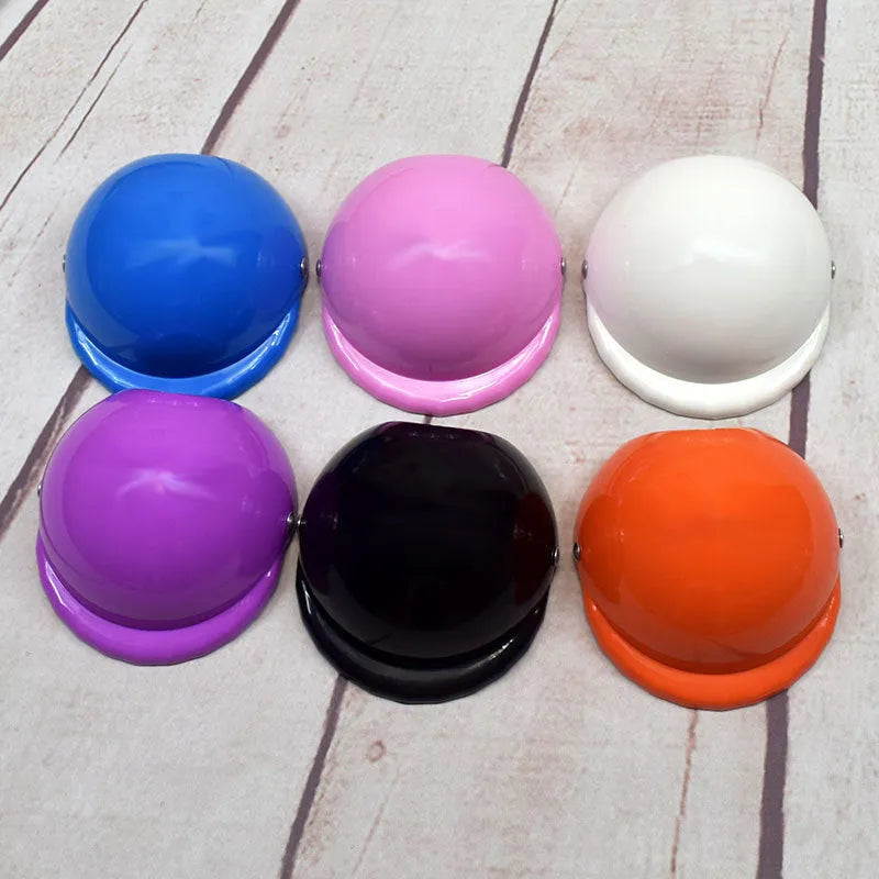 A pink plastic dog helmet cap showing its rigid shape and solid colour, sized for a small dog.