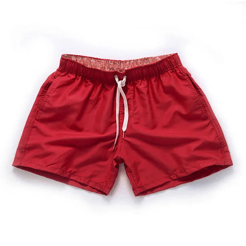 Men's straight leg beach shorts in polyester fabric available in multiple colours and sizes up to 4XL