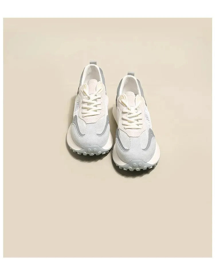 Women's grey and pink retro sneakers with low top design and rubber sole