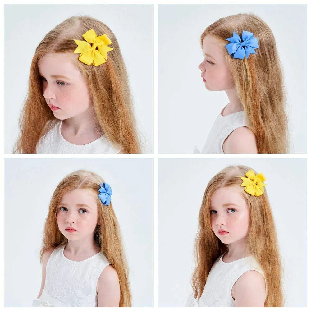 Assorted colour 3-inch grosgrain ribbon hair bows on alligator clips for toddler girls.
