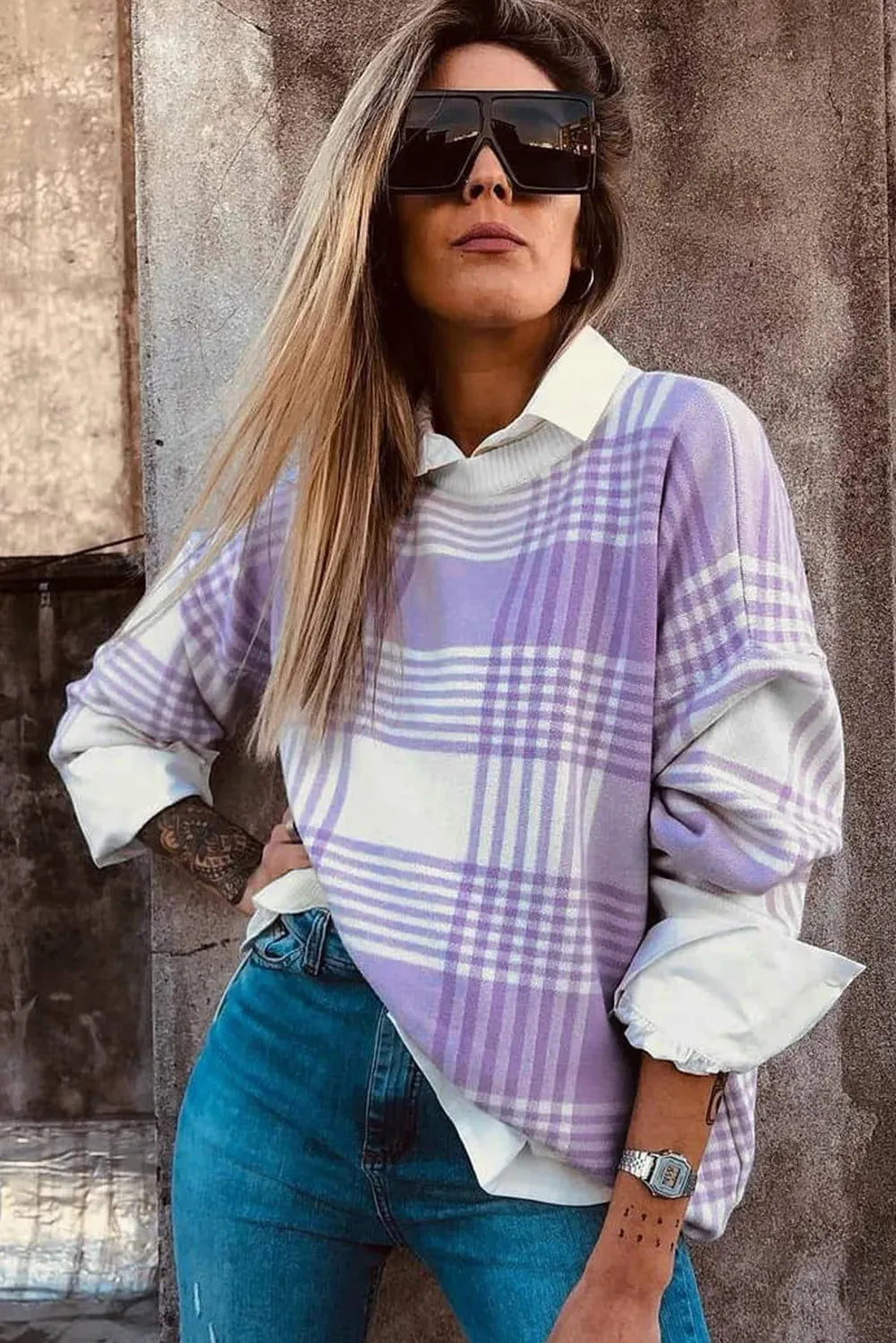 Lilac plaid print loose sweater with ribbed trim on mannequin