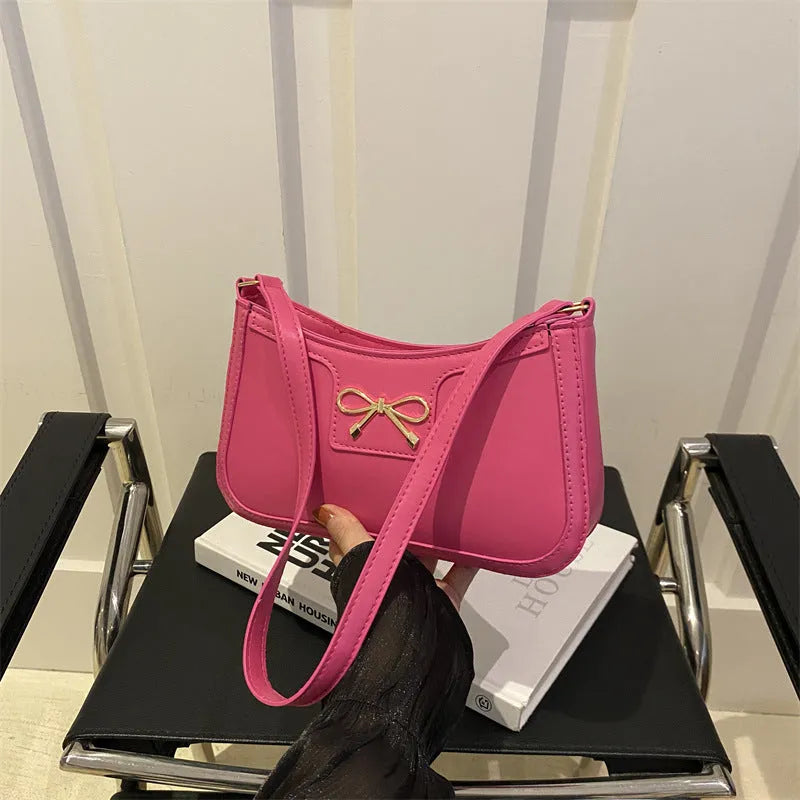Western-style baguette shoulder bag in PU leather with bow detail, 24cm wide
