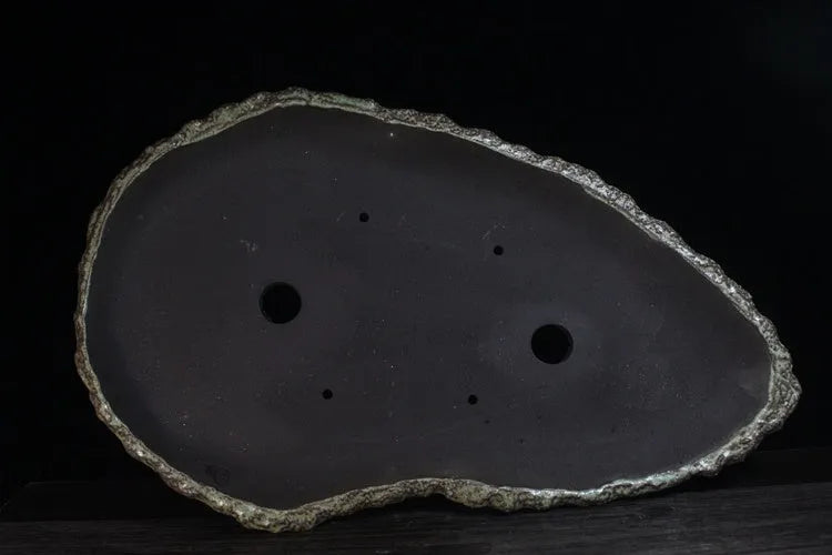Handmade purple clay flower pot showing traditional craftsmanship and floor-standing design