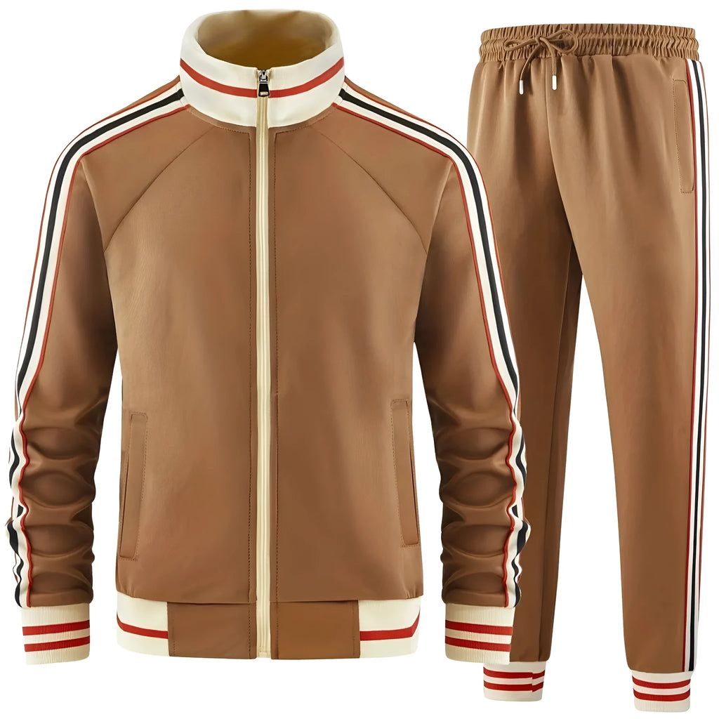 Khaki coloured two-piece street suit with a zippered turtleneck cardigan and matching trousers on a hanger.