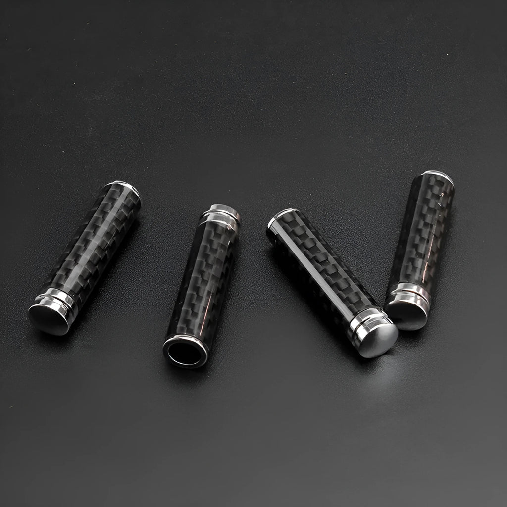 Set of four carbon fibre car door handle covers for universal fit installation.