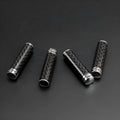 Set of four carbon fibre car door handle covers for universal fit installation.