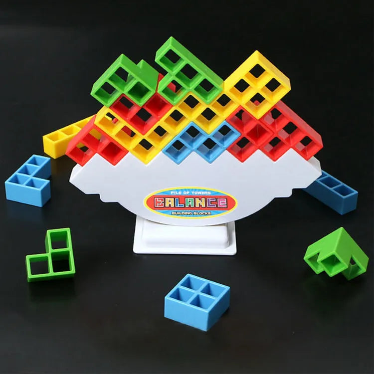 Plastic balance stacking board game with colourful blocks, chassis, and base on table