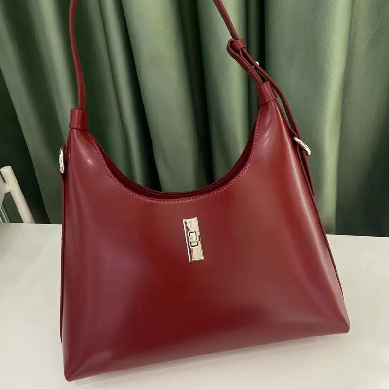 Genuine leather crossbody shoulder bag in dumpling shape with organised compartments