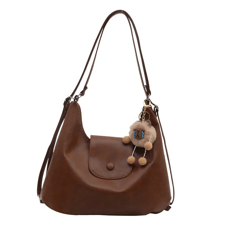 Textured PU leather commuter backpack with horizontal square design and single shoulder strap