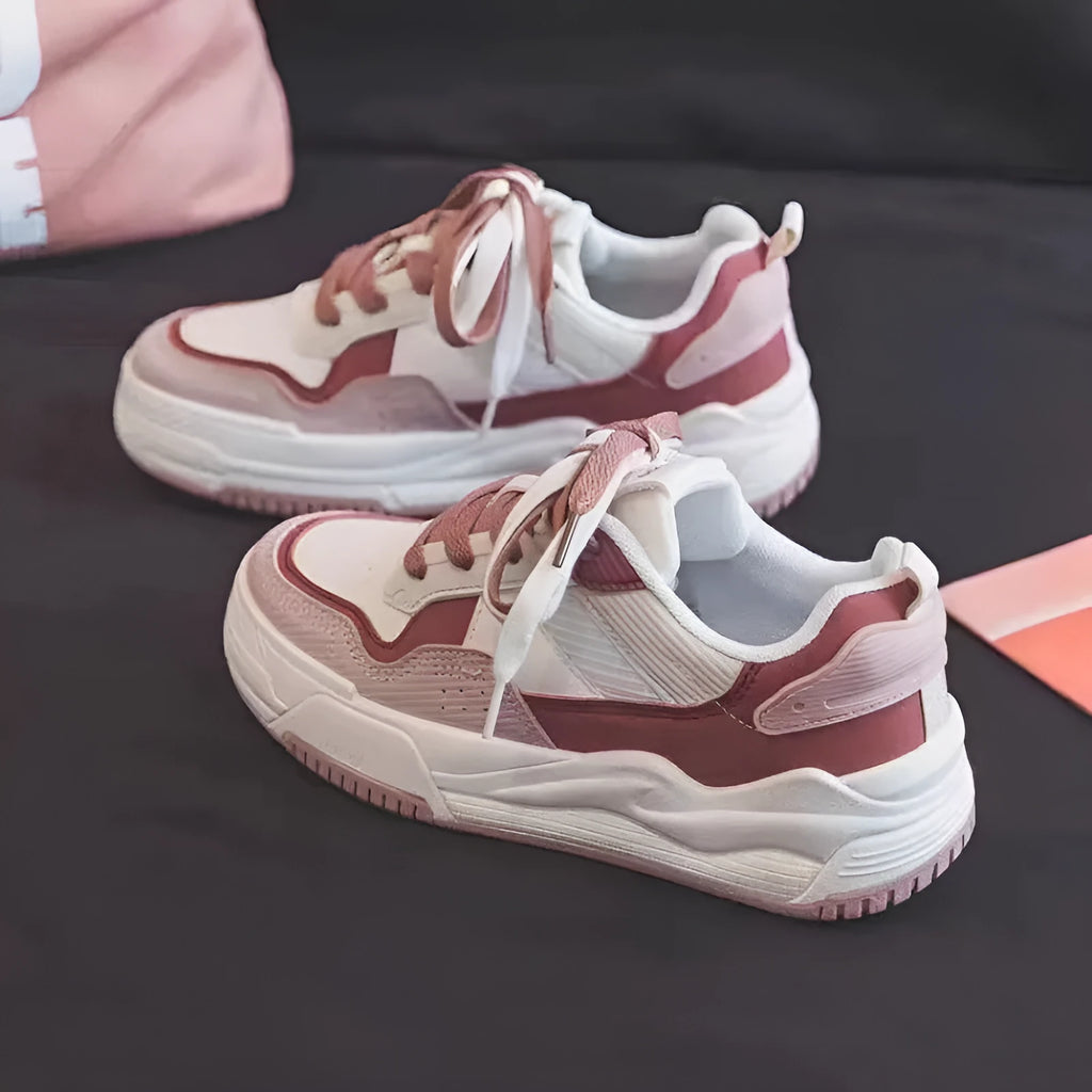 Pink and beige low top sneakers with rubber soles and height-increasing design