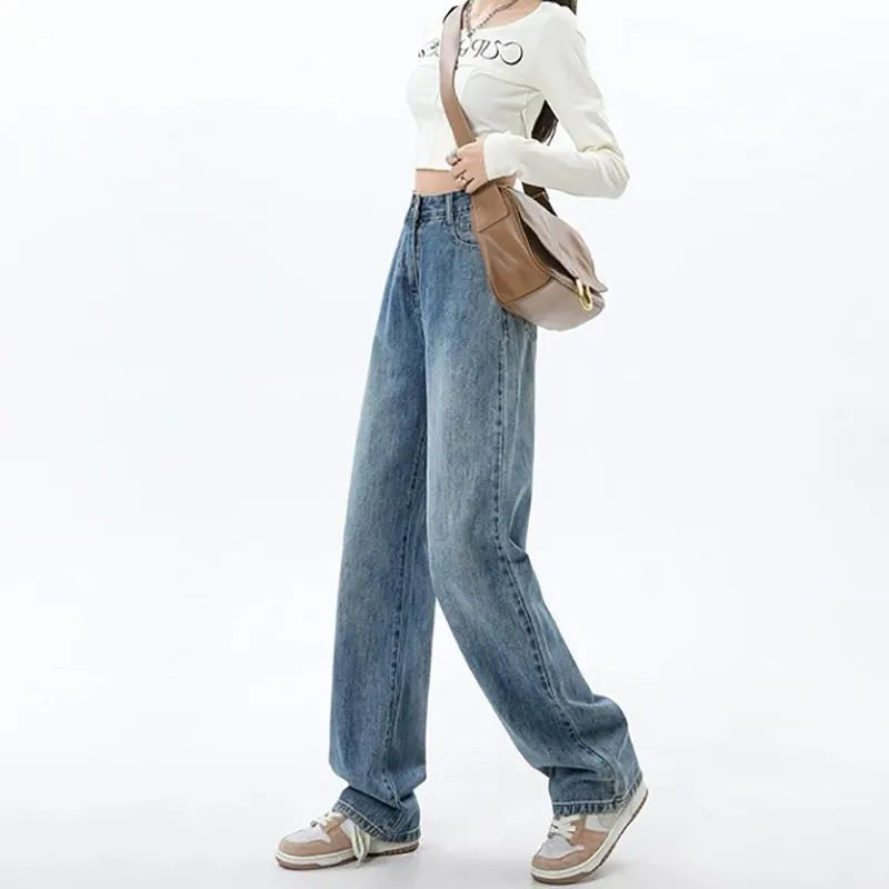 A woman wearing high-waisted retro blue wide-leg jeans made from stretch denim.