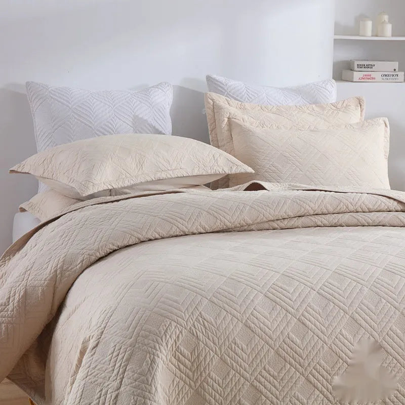 Pure cotton bedding set with damascus pattern showing embroidery details and quilted finish on bed