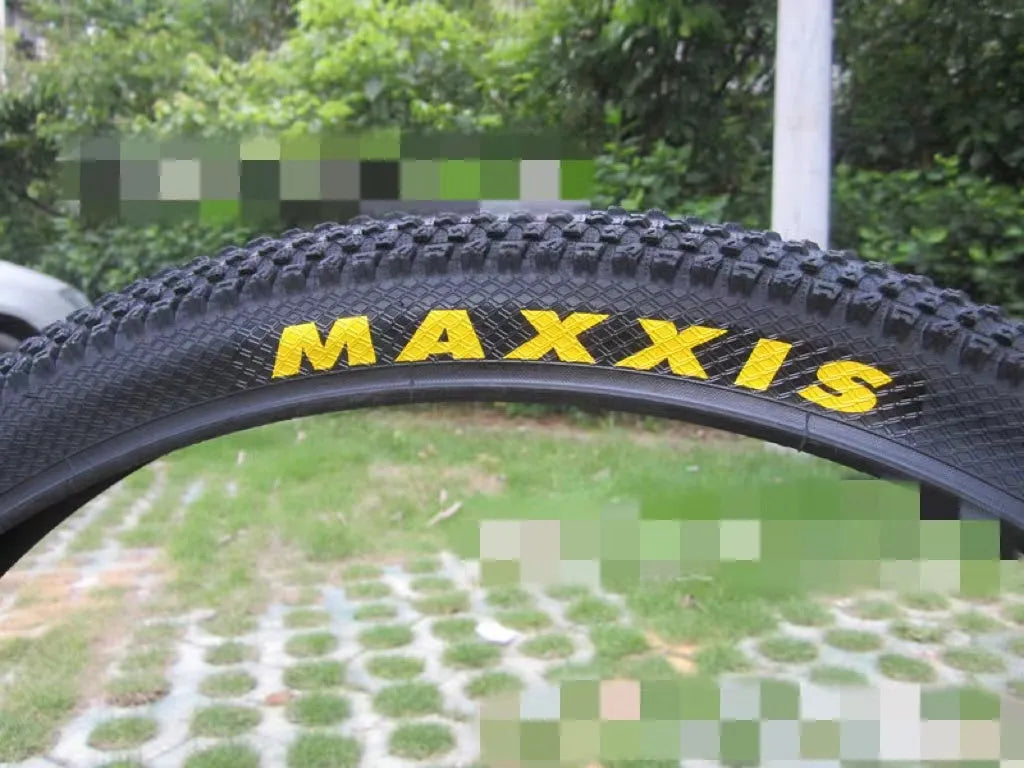 Ultralight mountain bike tyre with black tread, shown in 26, 27.5 and 29 inch sizes