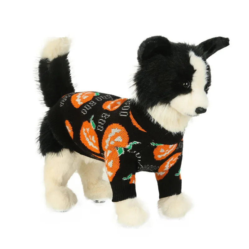Black dog sweater with a large orange Halloween pumpkin print on the back.