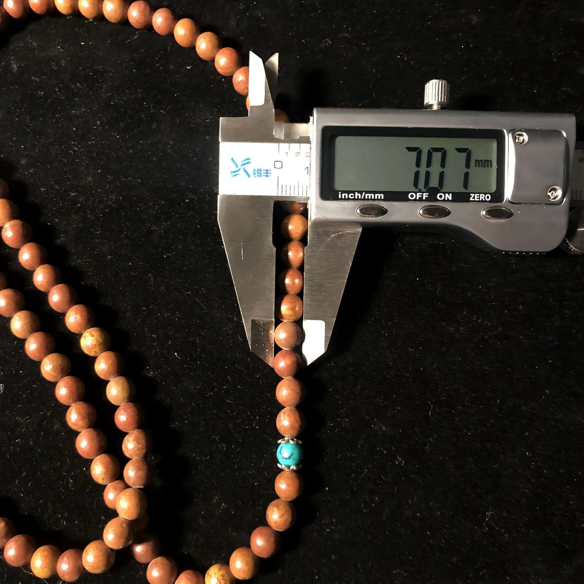 108-bead Lvzhu stone bracelet with geometric shaping and 5-6mm diameter beads on wrist