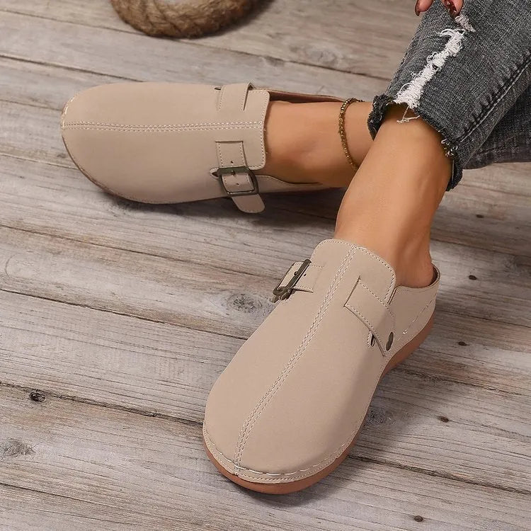 Women's lightweight wedge slippers in various colours with cloth upper and rubber sole.