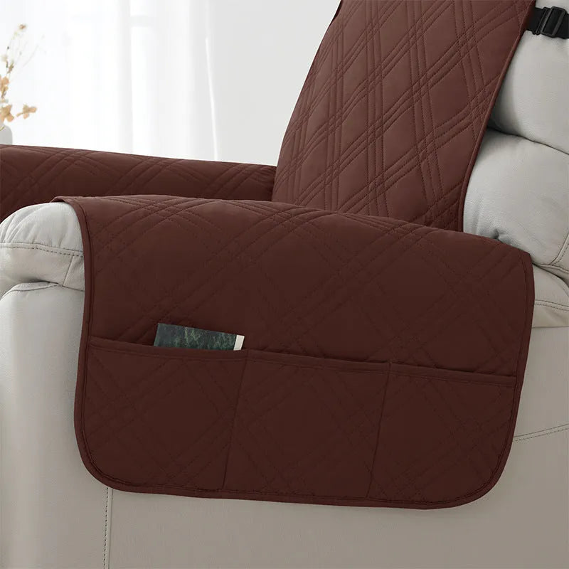 Quilted burgundy waterproof sofa cover stretched over a small single-seat massage chair cushion.