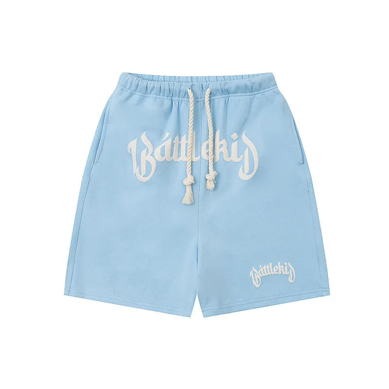 Loose fit cotton blended shorts in black, shown on a model for street style.