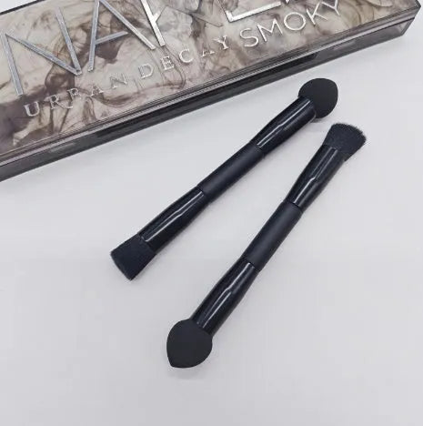 Double-headed makeup brush with miter sponge tip and artificial fibre bristles on wooden handle