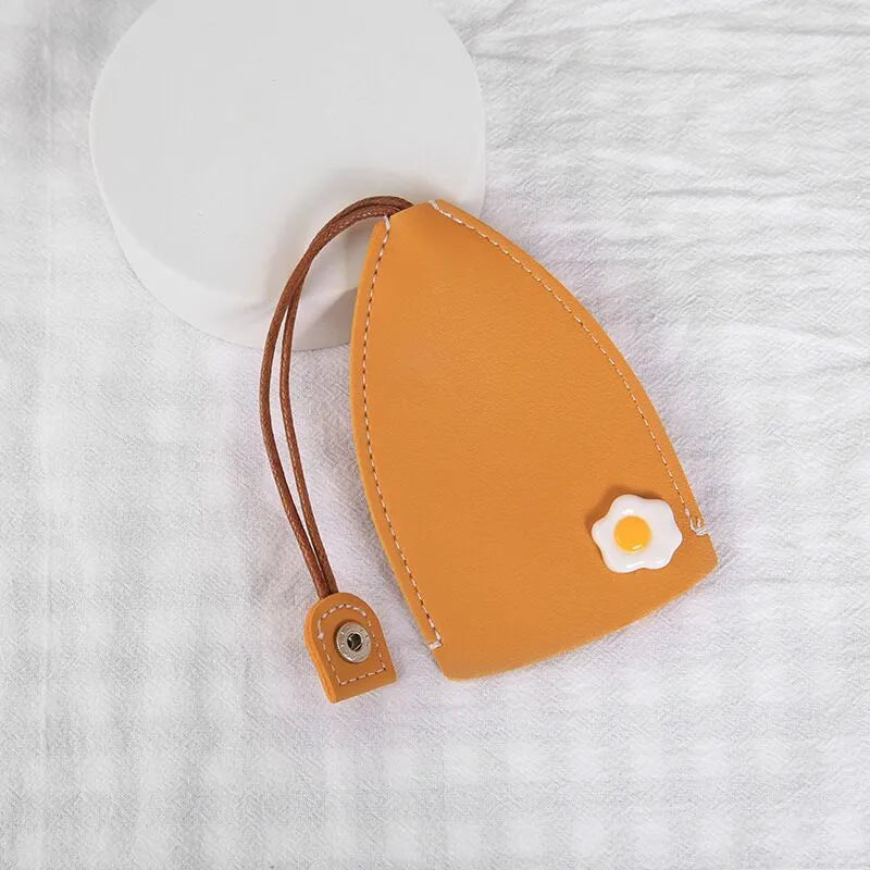 Cartoon PU leather pull-out car key case measuring 14 x 7.5cm with colourful designs