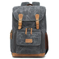 Khaki coloured canvas DSLR camera backpack with adjustable straps shown front-on.