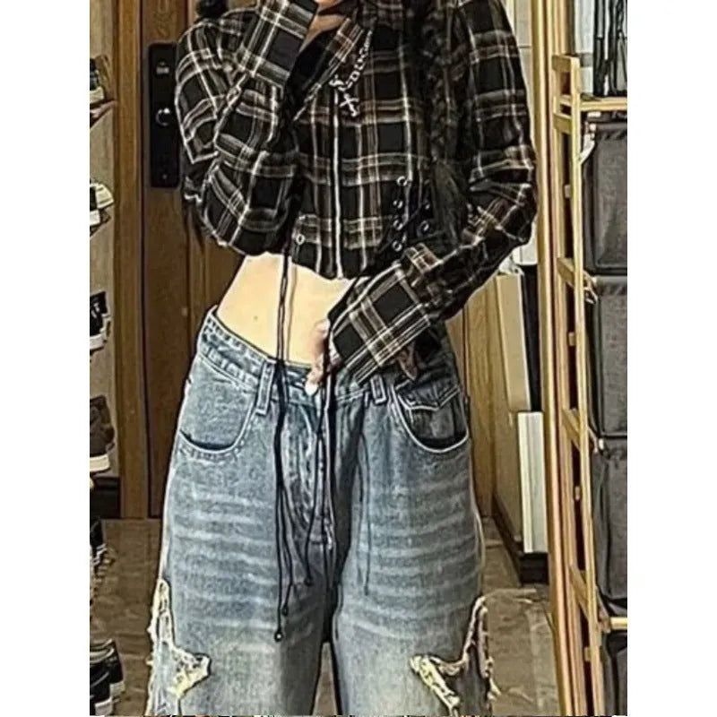 Blue women's high waist wide-leg denim jeans on a hanger, showing straight leg cut.