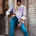 Lilac plaid print loose sweater with ribbed trim on mannequin