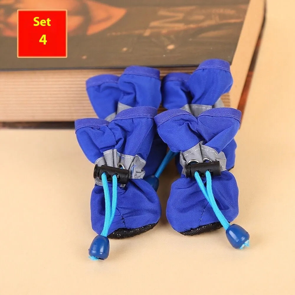 Cloth dog shoes with soft soles in multiple colours including red, black, blue, and monkey print designs