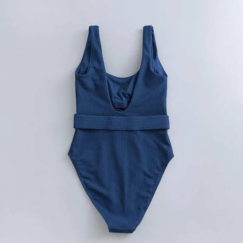 Navy blue women's one-piece slimming swimsuit with triangle design and chest pad.