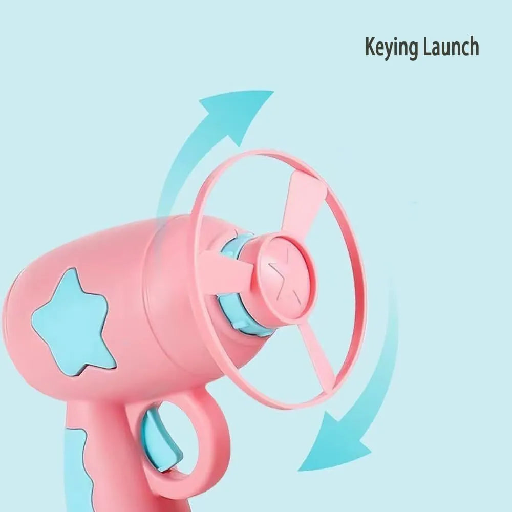 Blue interactive cat toy gun launcher with a mounted pink plastic frisbee, shown with a second frisbee disc.