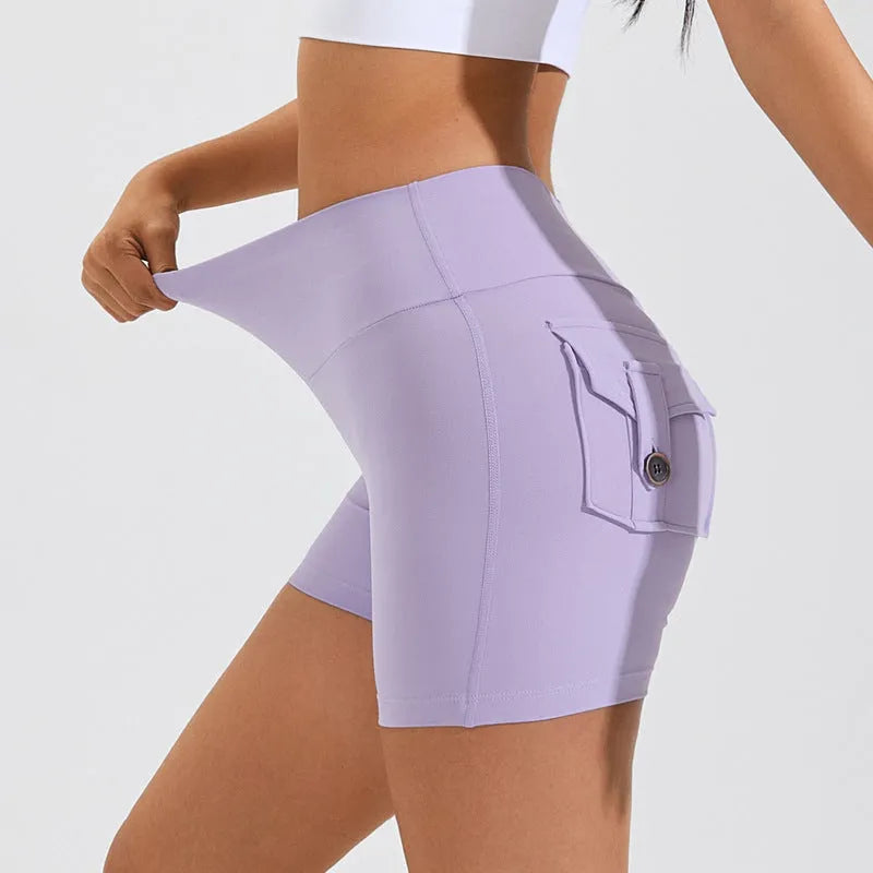 Women's high-waist fitness shorts in quick-dry nylon with side pockets, shown in Electric Blue.