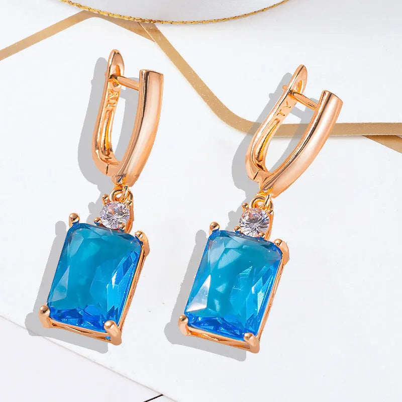 Square geometric copper earrings with electroplated gold finish showing quadrilateral shape design