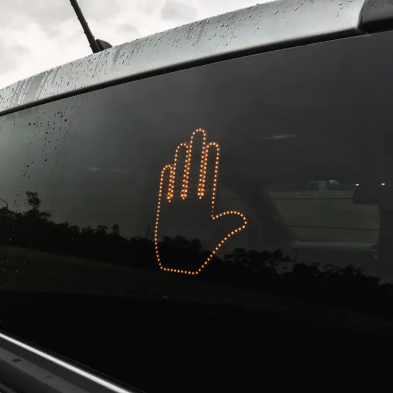 Black plastic LED illuminated gesture hand sign light for cars with remote control