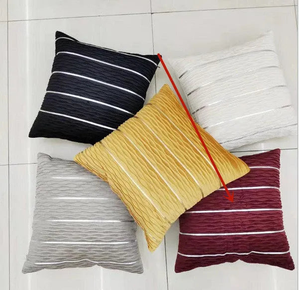 Striped velvet pillow cover in wine red colour on grey sofa