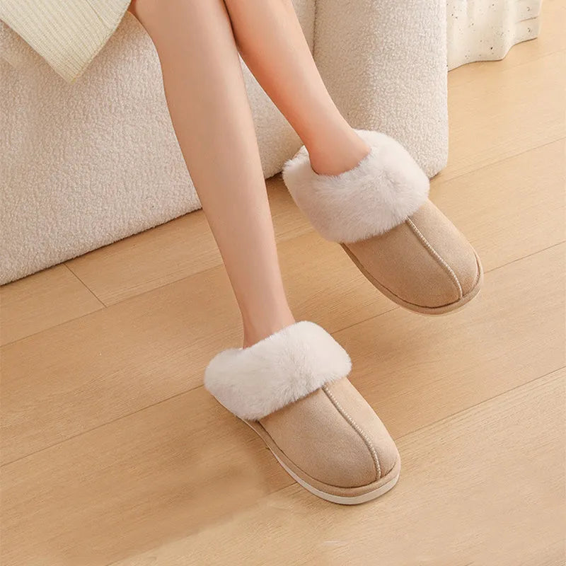 Women's plush winter slippers in pink with a round toe, flat heel, and anti-slip PVC sole.
