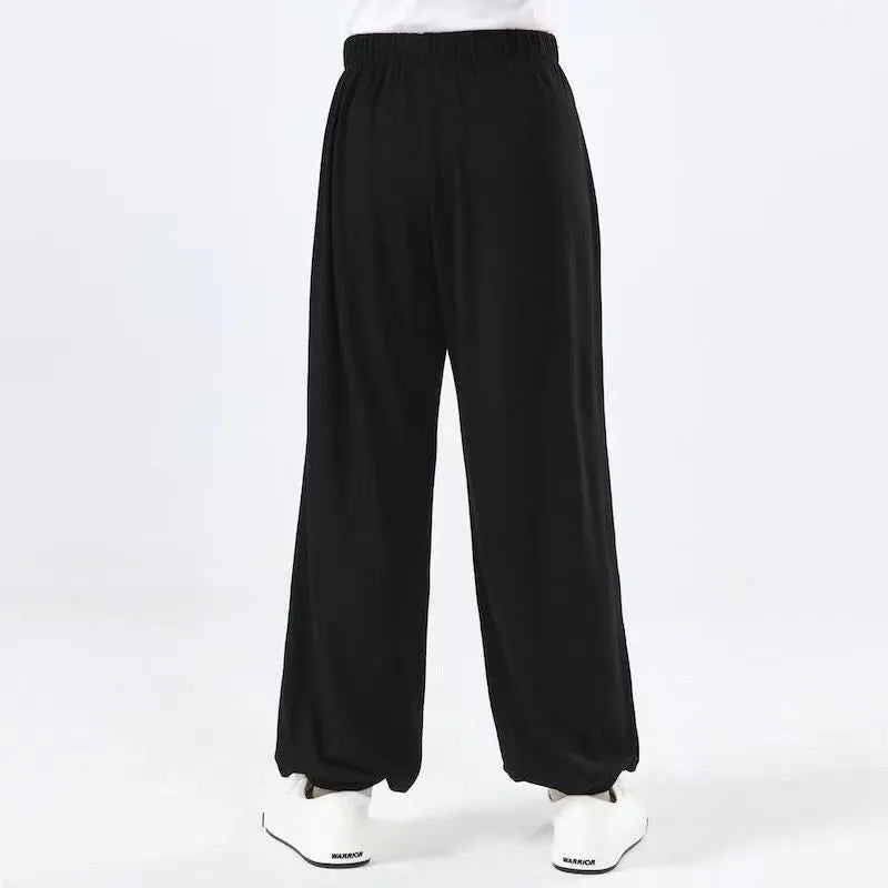 Children's black high elasticity Sanda practice pants with loose fit for martial arts training