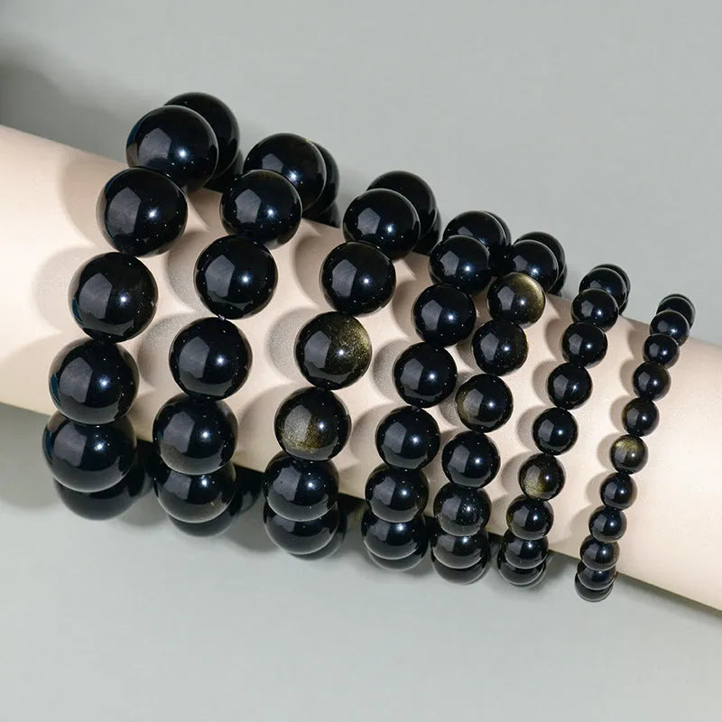 Hand-woven obsidian bracelet with round crystal beads in multiple colour options and sizes