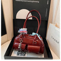 Retro one shoulder underarm pillow bag in PU leather with flap closure and double strap in black brown or red colour options