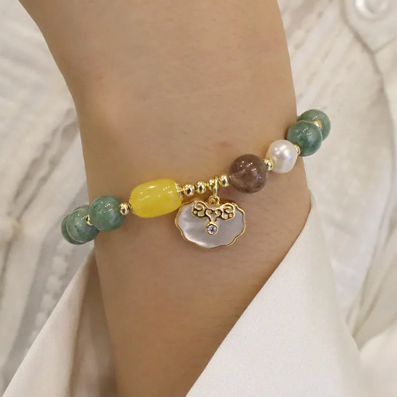 Natural green jade stretch bracelet with polished beads on wrist