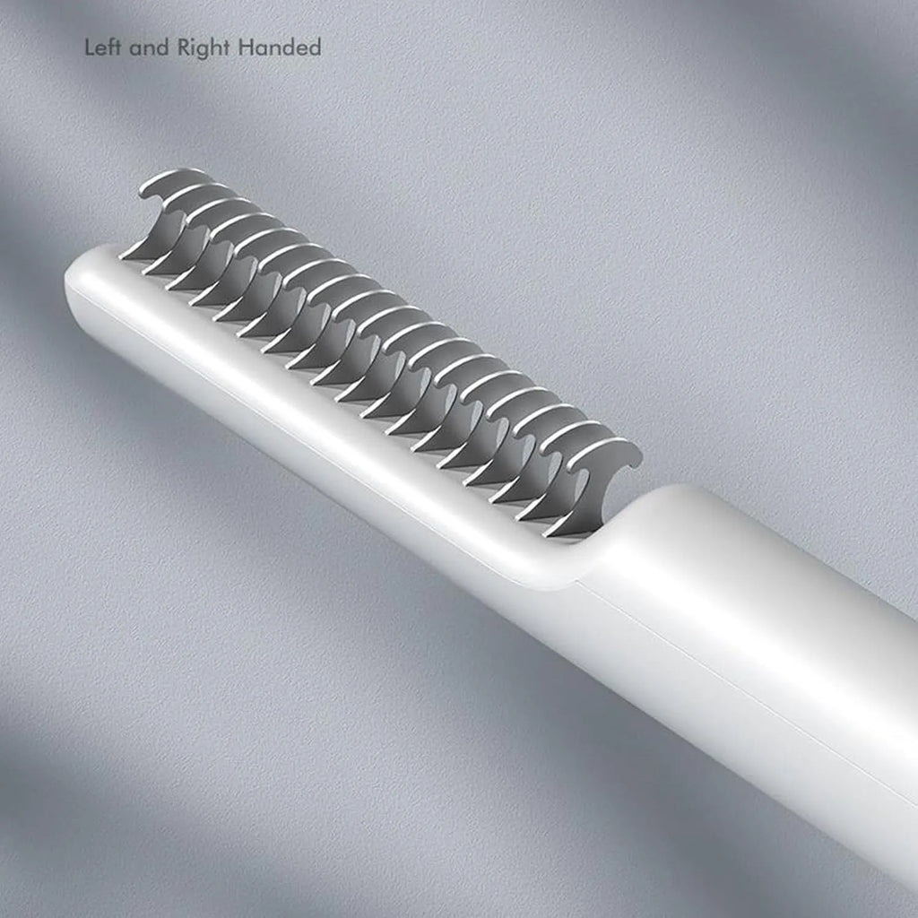 Stainless steel dematting comb for dogs with a user-friendly handle on a pink background.